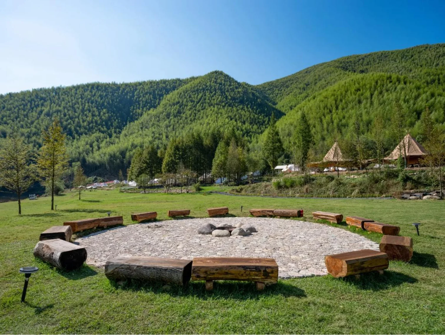 Open lawn and circular gathering area showing an outdoor experience opportunity