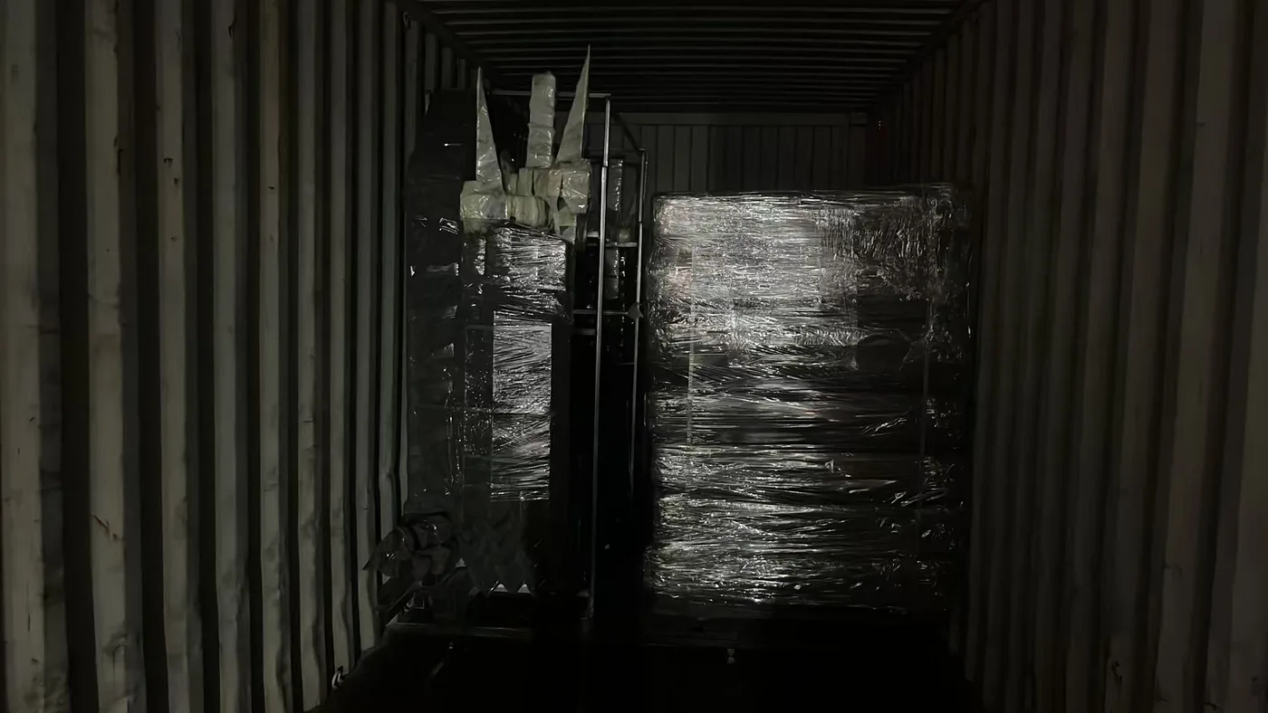 Protected modular building components inside a shipping container