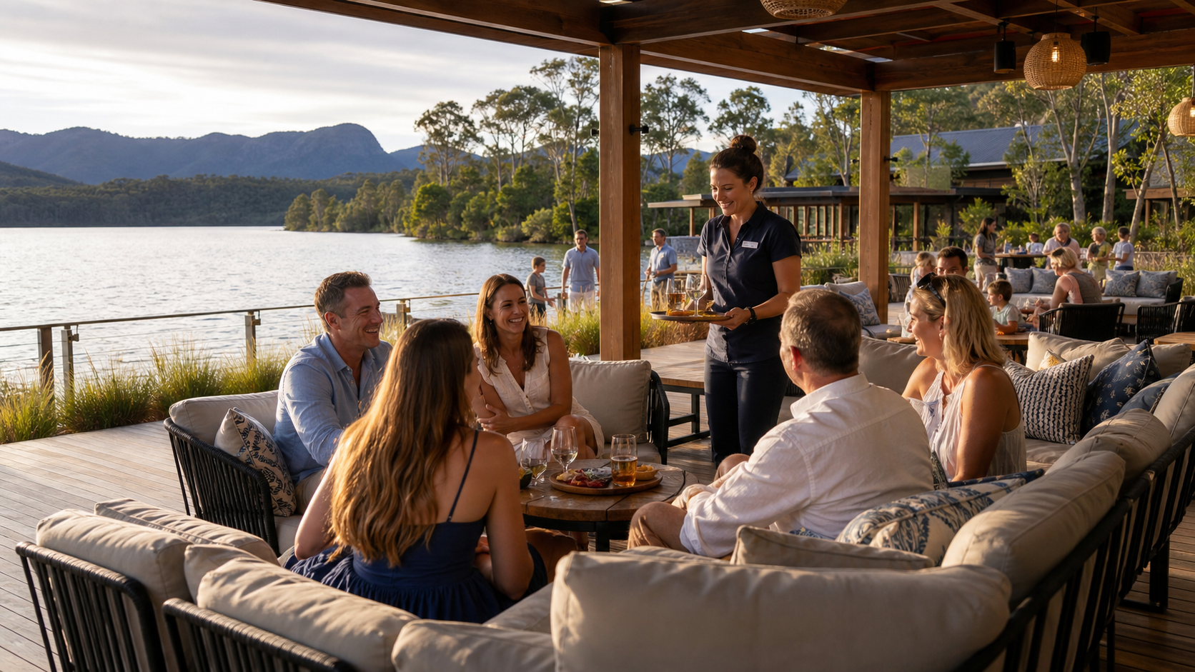 Illustrative resort experience with guests gathering in a waterfront social space