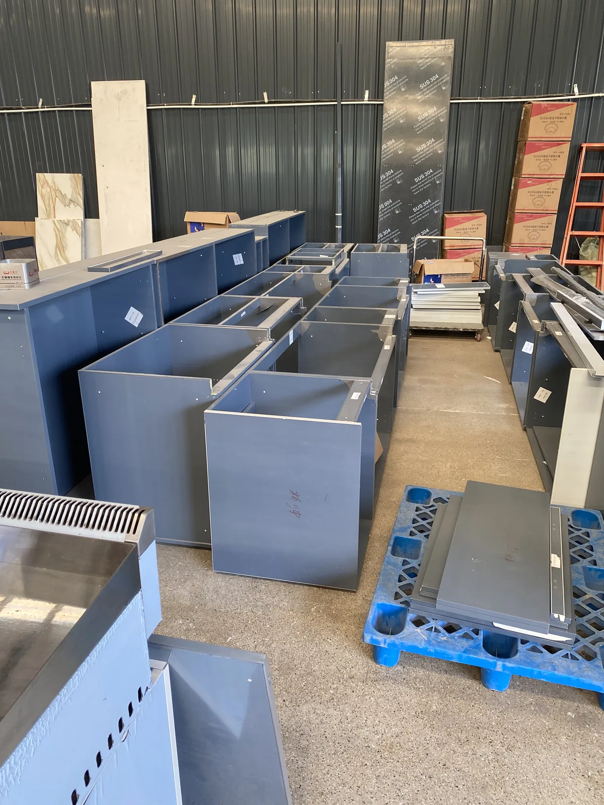 Outdoor kitchen cabinet bodies prepared in a factory