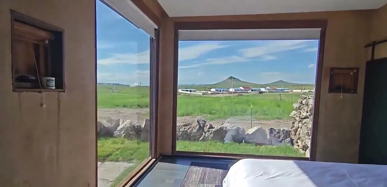 Interior view through a capsule cabin window beside the bedroom