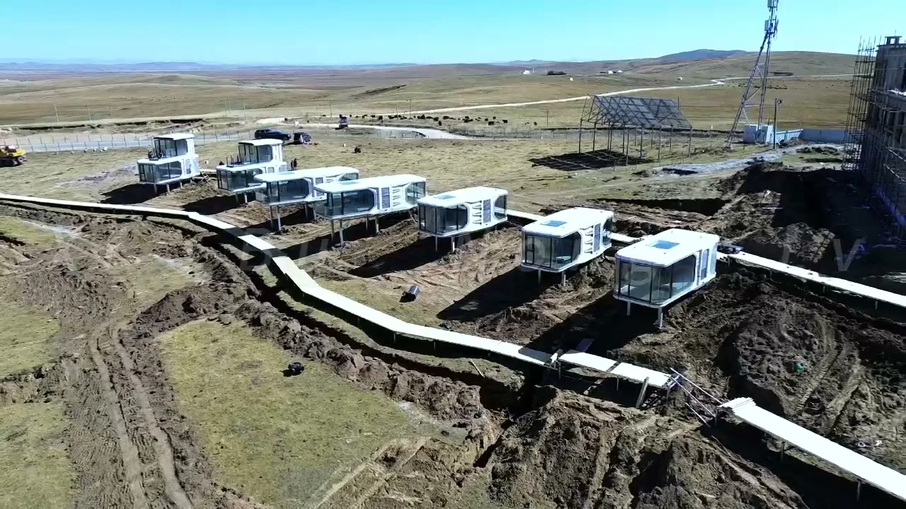 Multiple space capsule cabins placed within an open scenic area